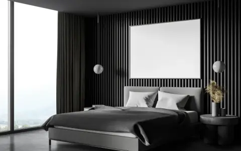 Habitación moderna con cama gris, ventanal y pared acanalada. Ideas para como insonorizar una habitacion con materiales acústicos.