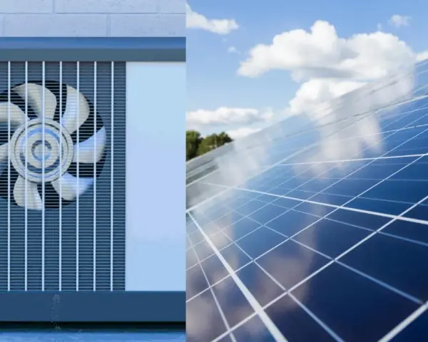Unidad exterior de aerotermia junto a un campo de placas solares bajo un cielo azul con nubes.