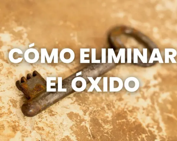 Una llave antigua y oxidada sobre una superficie texturizada, con el texto "CÓMO ELIMINAR EL ÓXIDO" superpuesto.