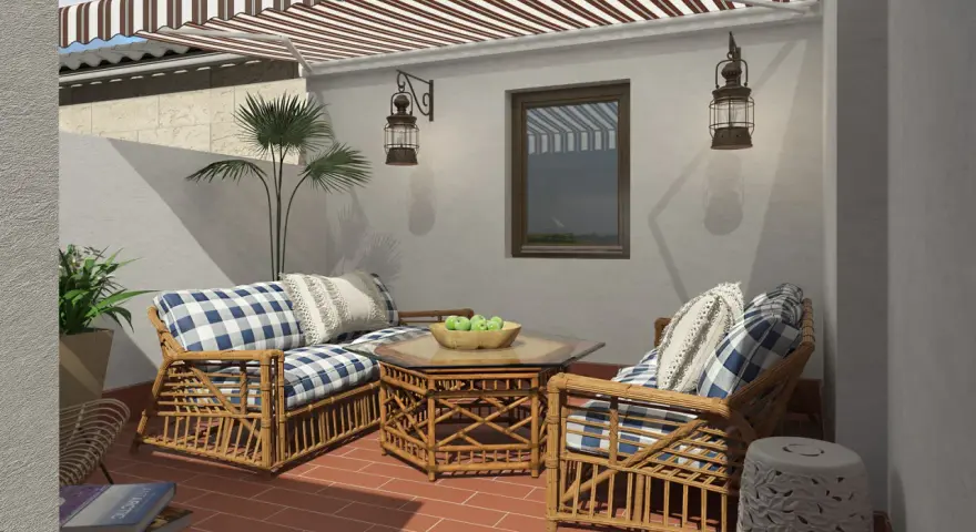 Cómodos sillones de mimbre con cojines a cuadros, mesa de centro con frutas, y un toldo a rayas. ¡Perfectas ideas de jardín para relajarse!