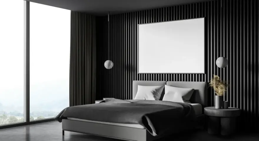 Habitación moderna con cama gris, ventanal y pared acanalada. Ideas para como insonorizar una habitacion con materiales acústicos.