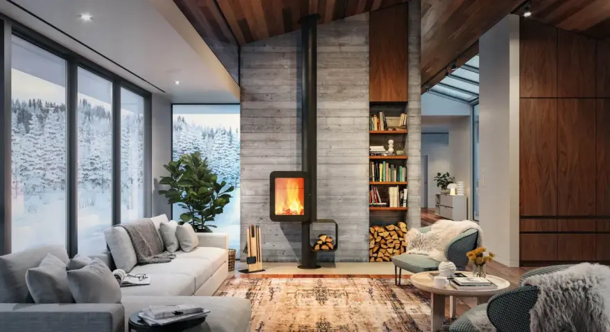 Chimenea moderna de leña, un ejemplo de los tipos de chimenea que calientan este acogedor salón con vistas nevadas.