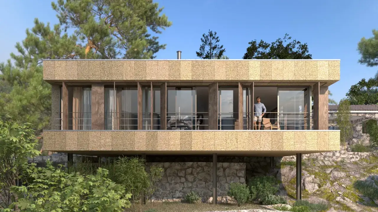 Casa moderna con grandes ventanales y balc&oacute;n, mostrando diversos tipos de cerramientos. Un hombre observa el paisaje.