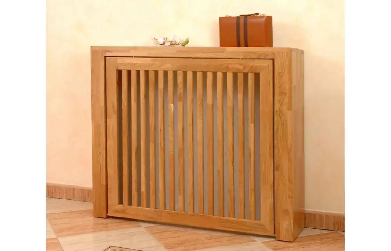 Elegante cubre radiador casero de madera, con dise&ntilde;o de lamas verticales. Un toque r&uacute;stico y funcional para tu hogar.